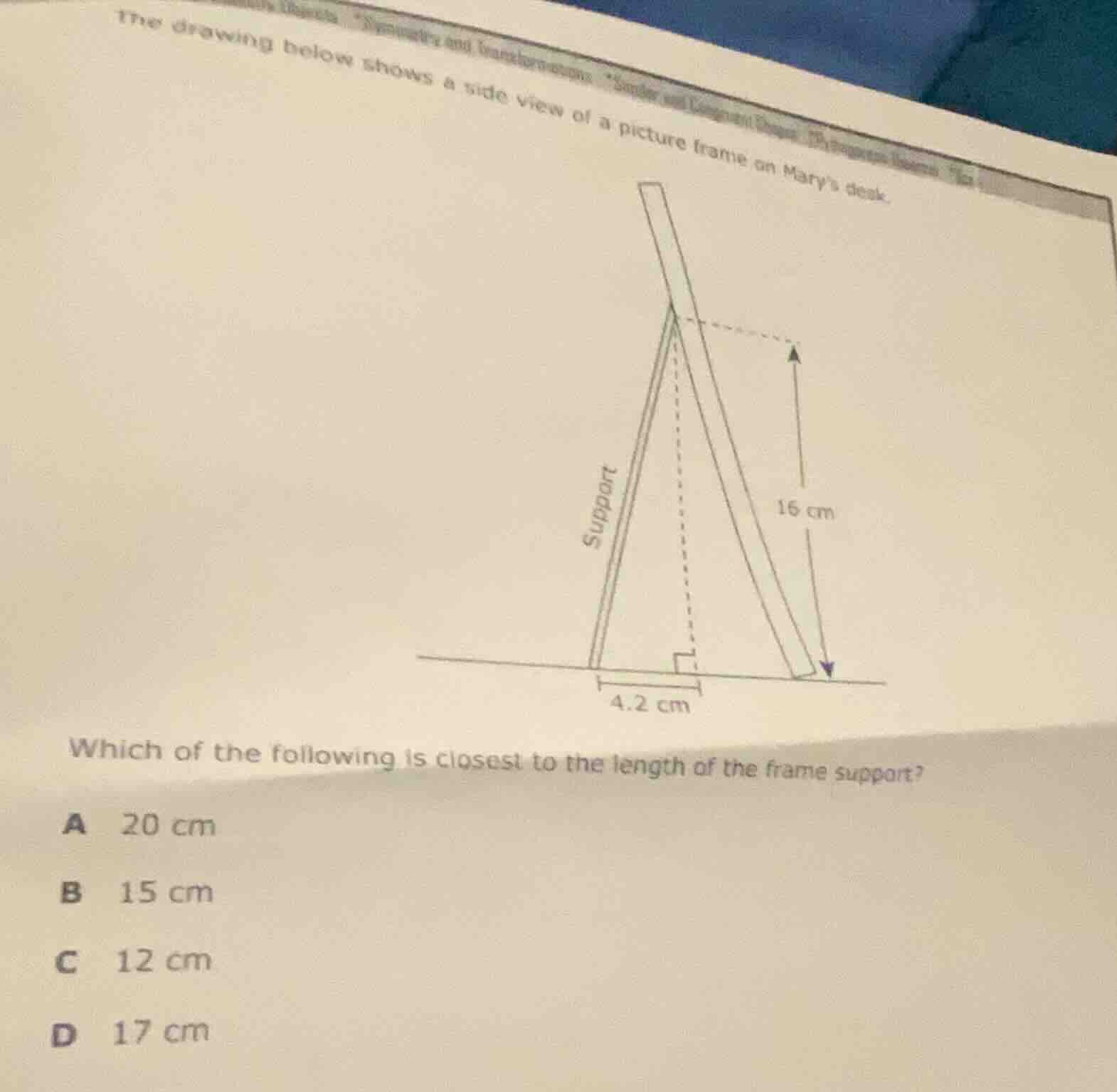 the drawing below shows a side view of a picture frame on marys desk. i…