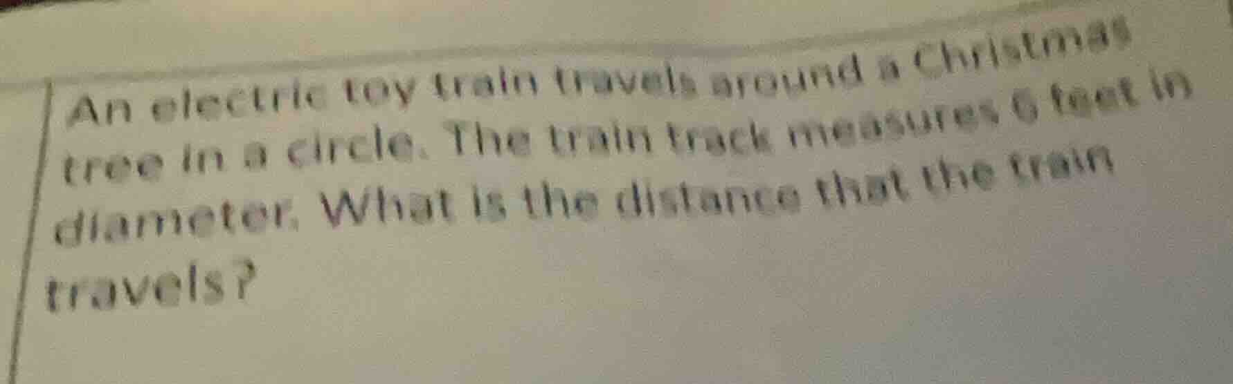 an electric toy train travels around a christmas tree in a circle. the …