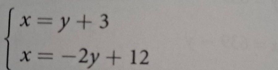 \\begin{cases} x = y + 3 \\\\ x = -2y + 12 \\end{cases}