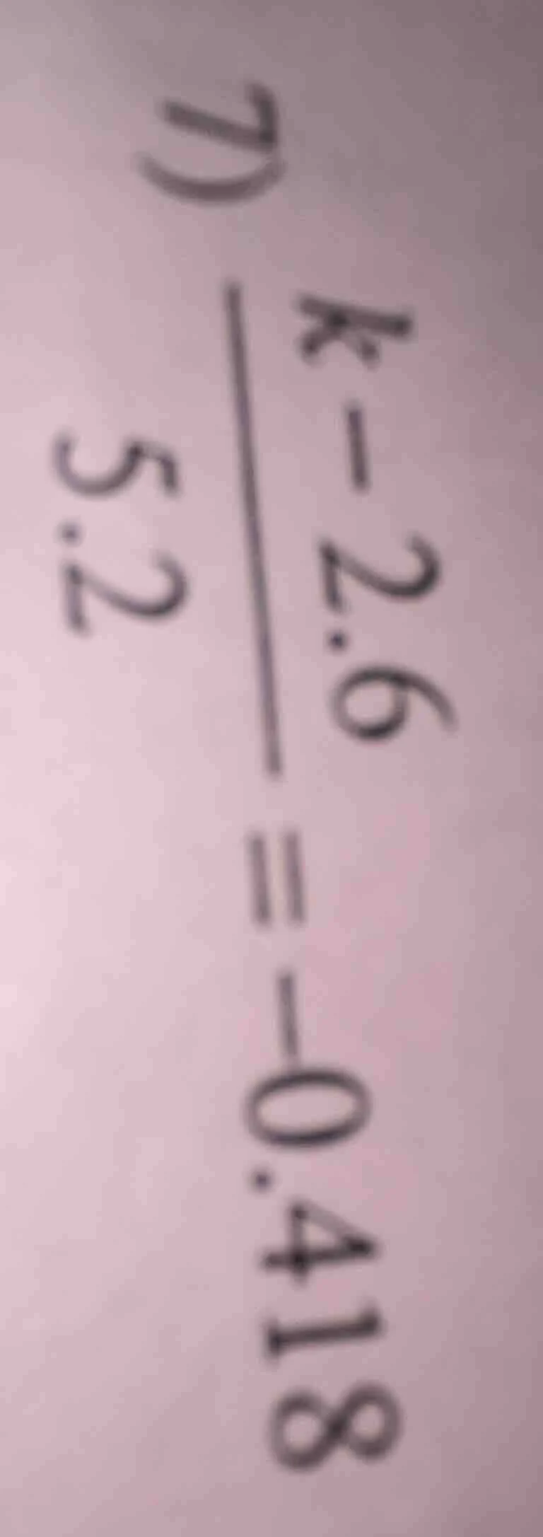 d) \\(\\frac{k - 2.6}{5.2} = -0.418\\)