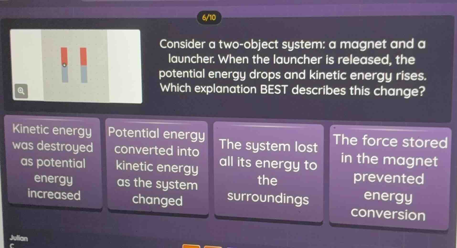consider a two - object system: a magnet and a launcher. when the launc…