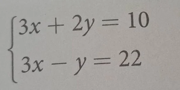 solve the system of equations \\(\\begin{cases} 3x + 2y = 10 \\\\ 3x - …