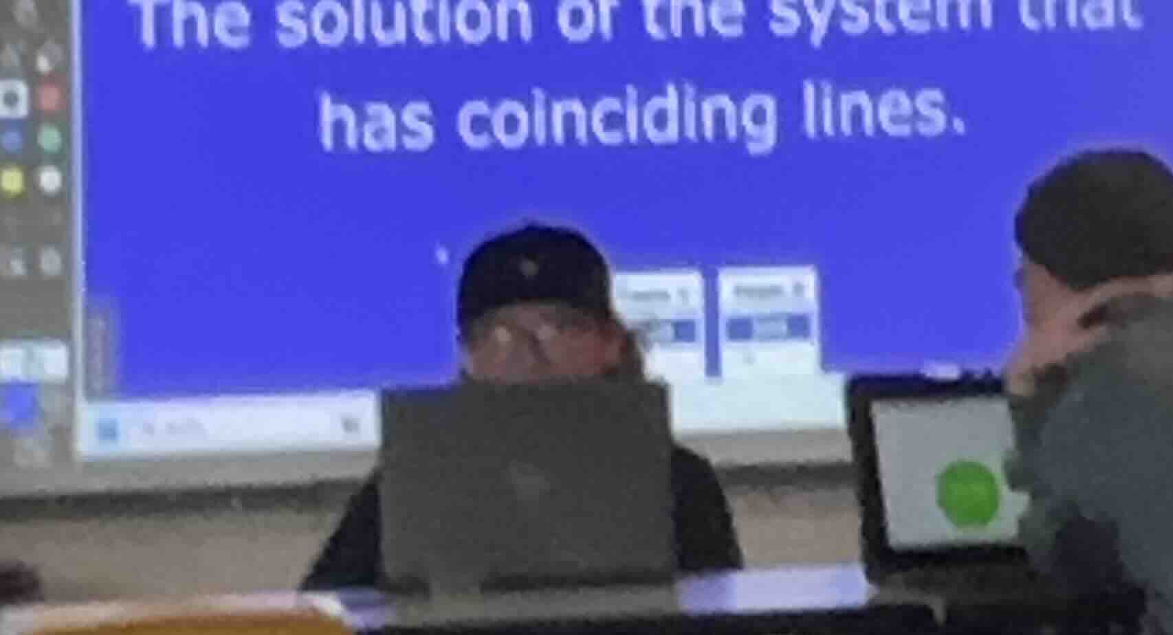 the solution of the system that has coinciding lines.