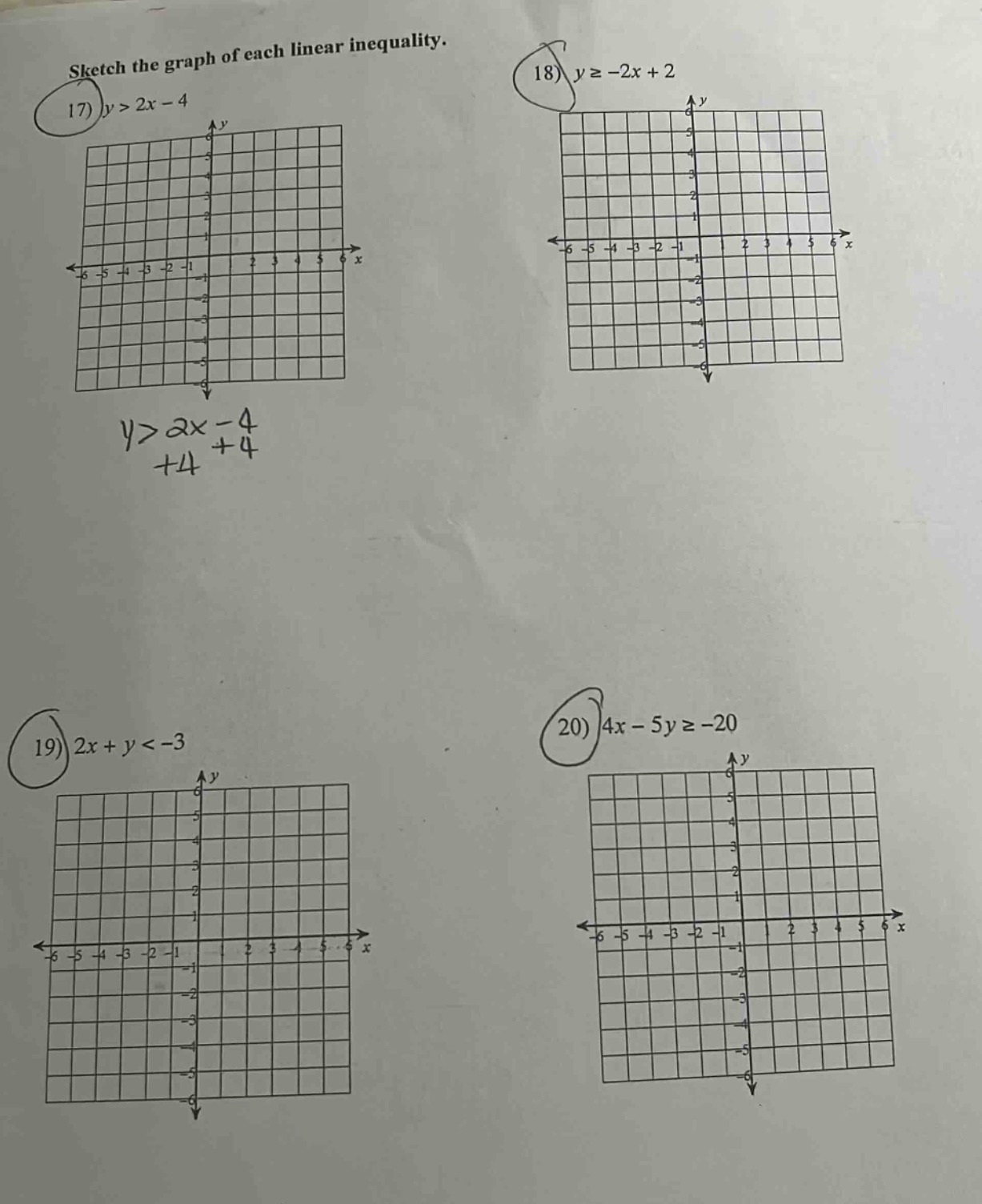 sketch the graph of each linear inequality. 17) $y > 2x - 4$ 18) $y \\g…