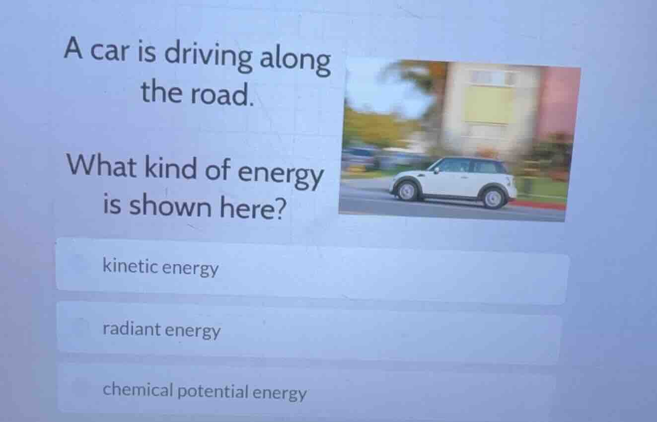a car is driving along the road. what kind of energy is shown here? kin…