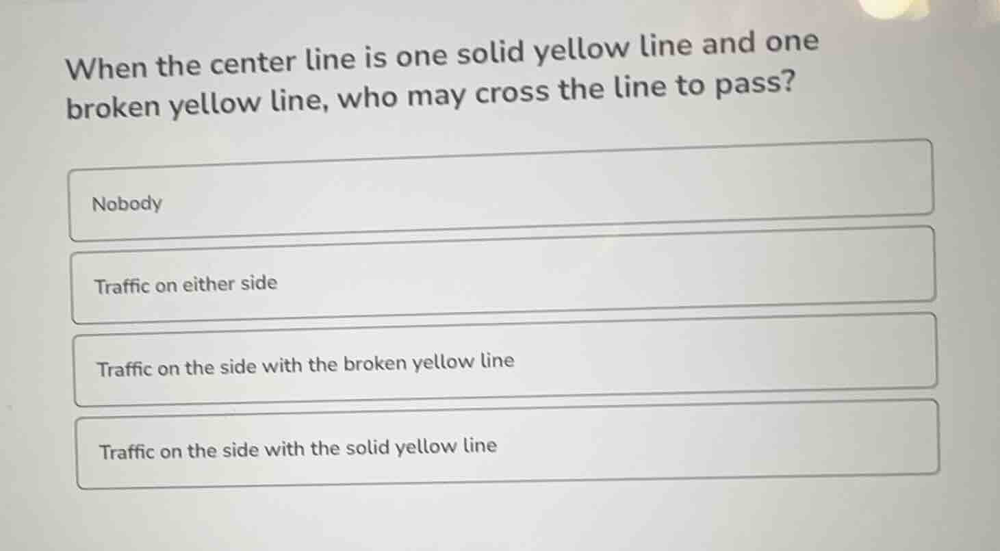 when the center line is one solid yellow line and one broken yellow lin…