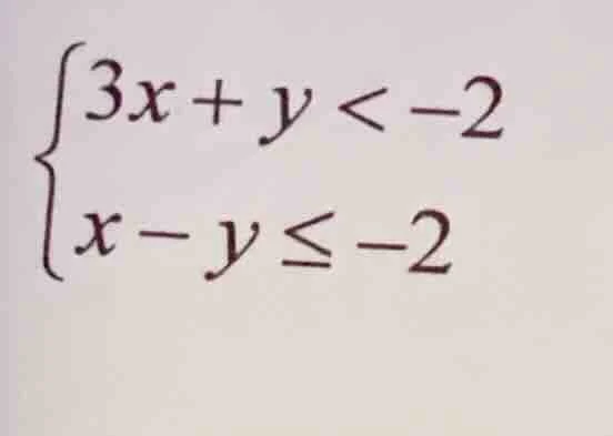 \\begin{cases} 3x + y < -2 \\\\ x - y \\leq -2 \\end{cases}