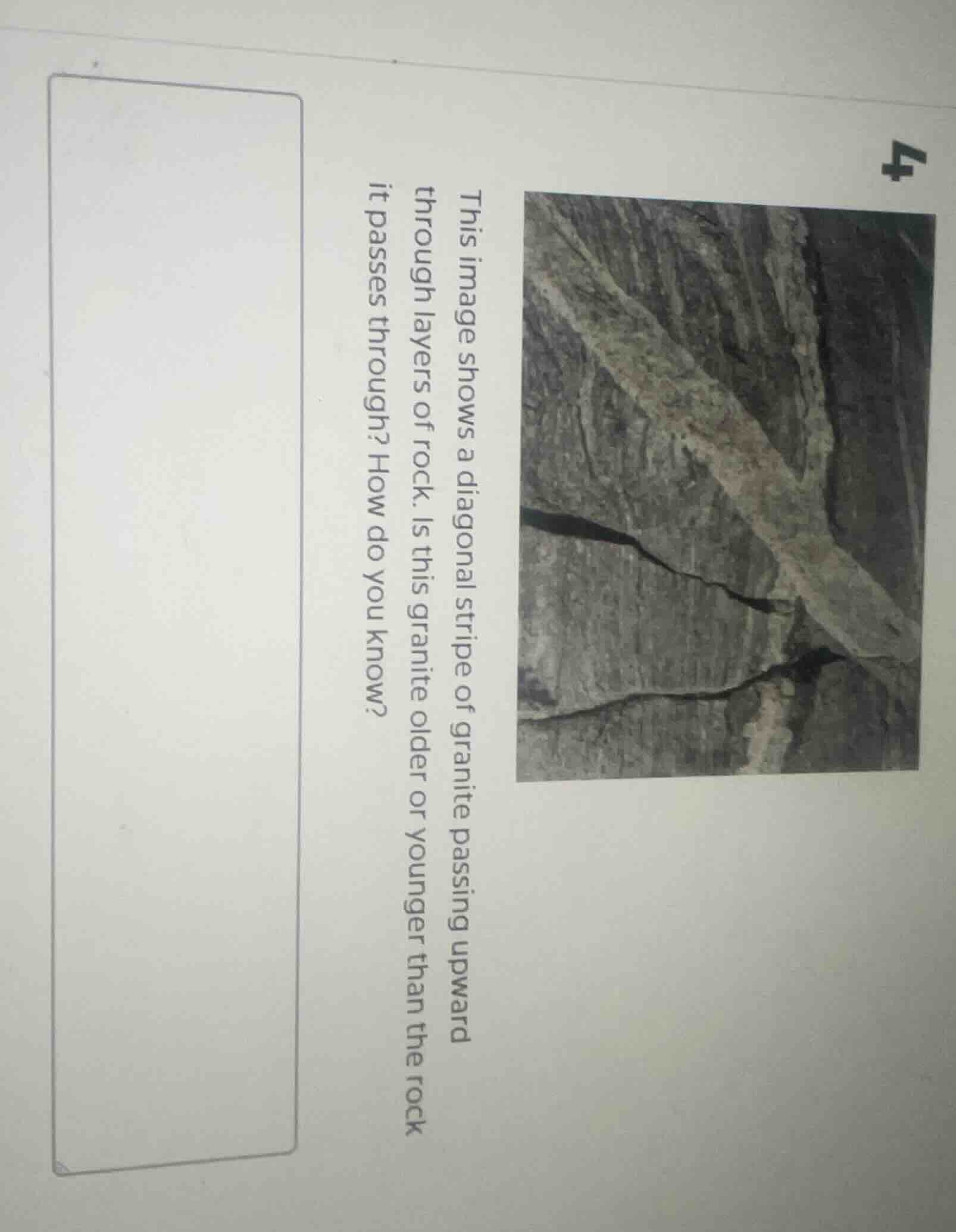 this image shows a diagonal stripe of granite passing upward through la…