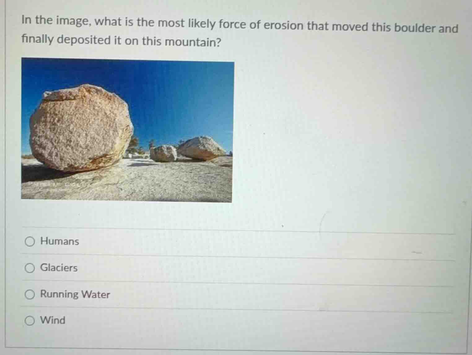 in the image, what is the most likely force of erosion that moved this …