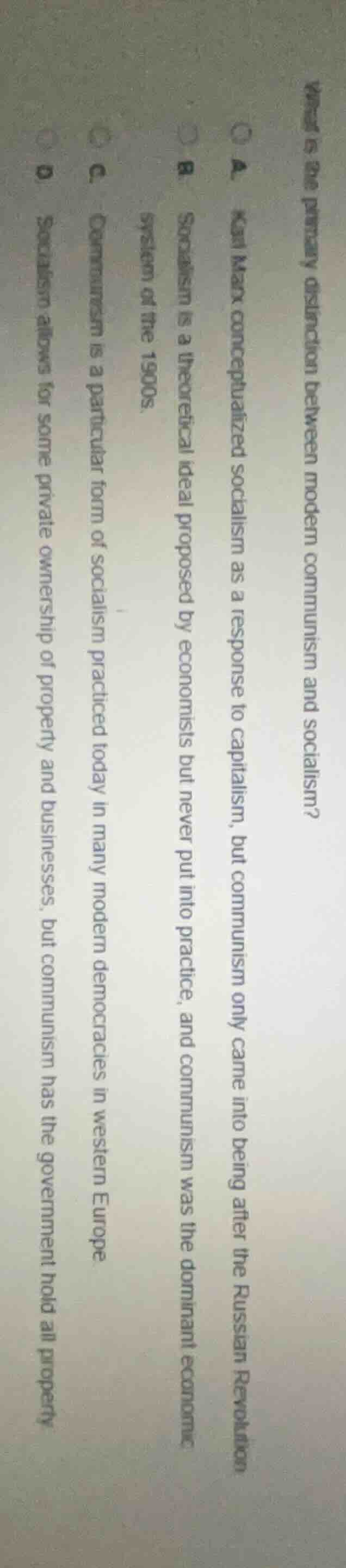 what is the primary distinction between modern communism and socialism?…