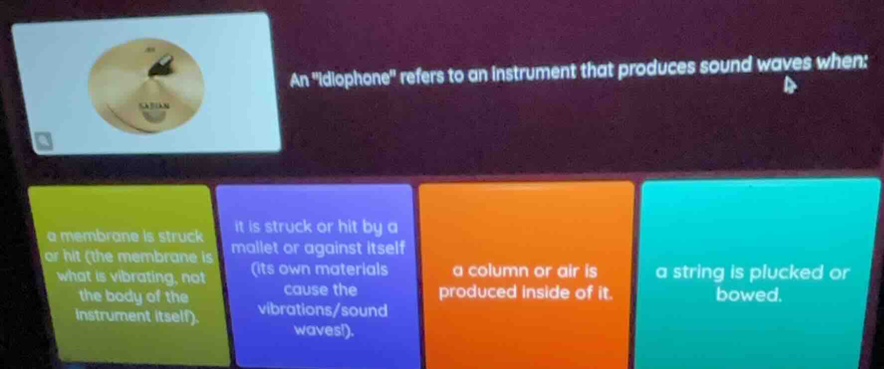 an \idiophone\ refers to an instrument that produces sound waves when: …