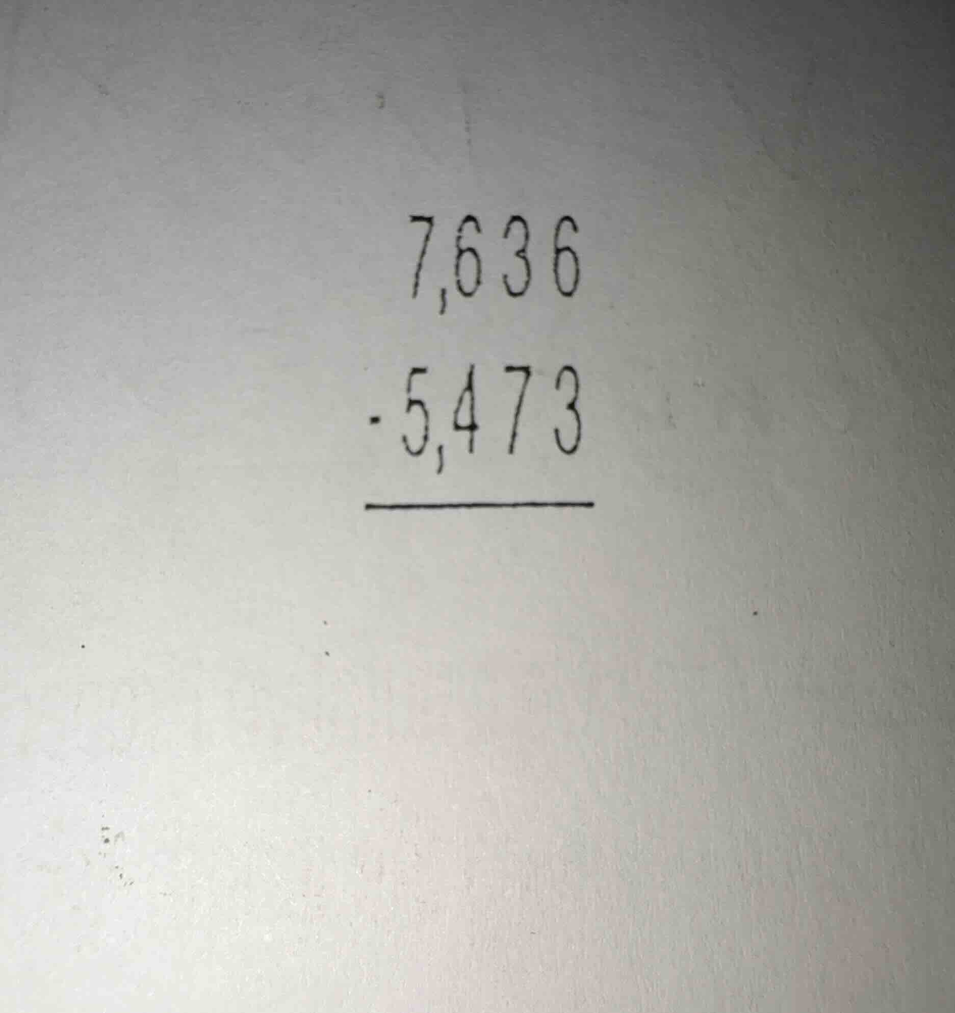$7,636 - 5,473$