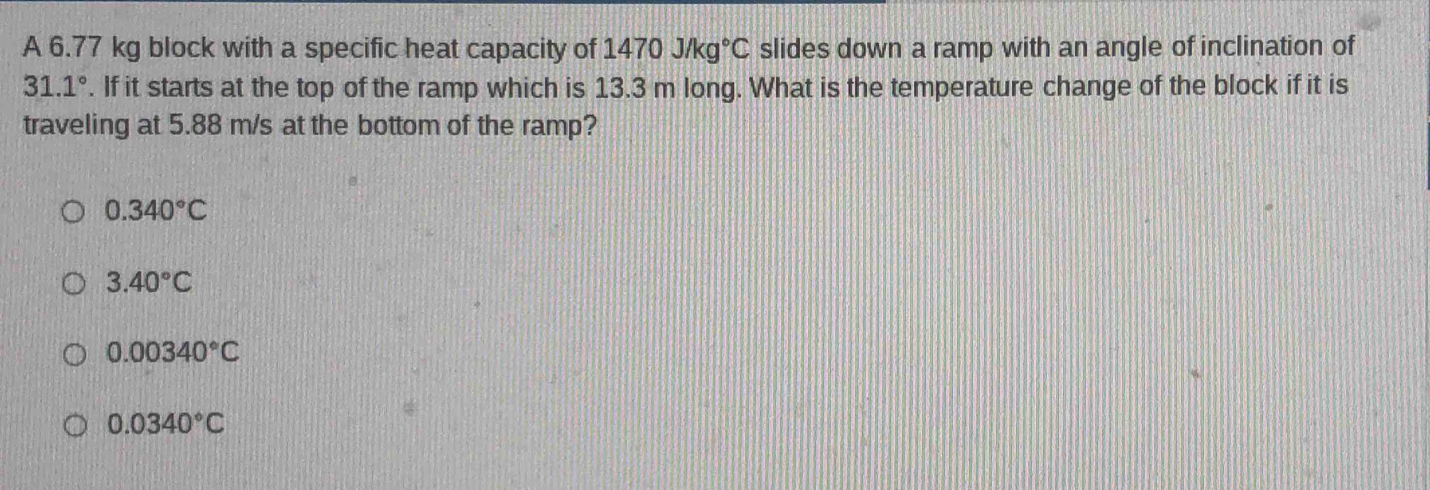 a 6.77 kg block with a specific heat capacity of 1470 j/kg°c slides dow…