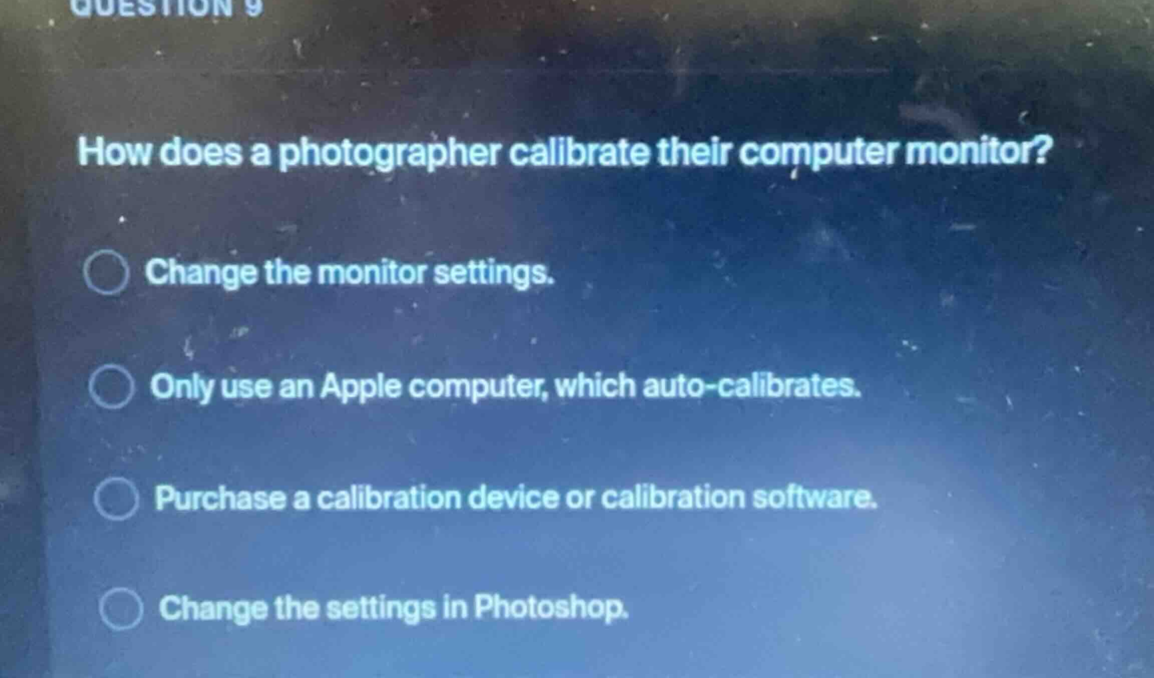 how does a photographer calibrate their computer monitor? change the mo…