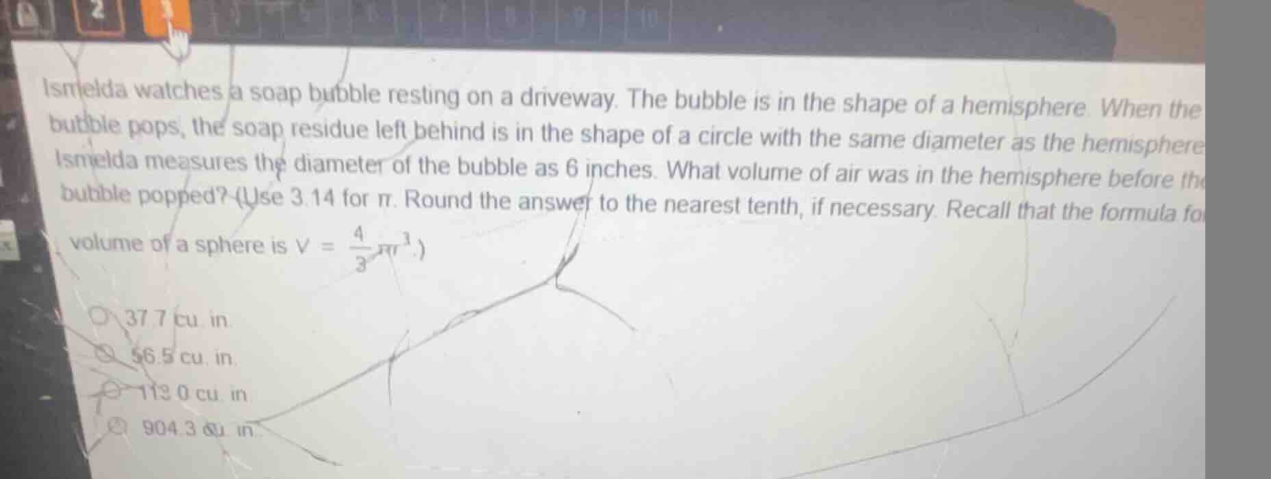 ismelda watches a soap bubble resting on a driveway. the bubble is in t…