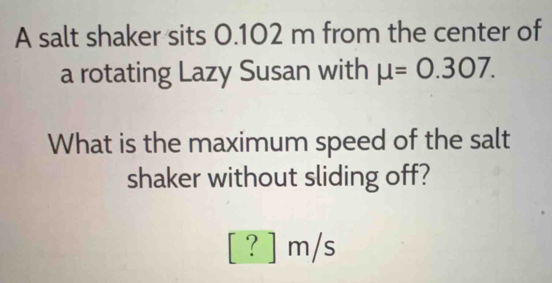 a salt shaker sits (0.102\text{ m}) from the center of a rotating lazy …