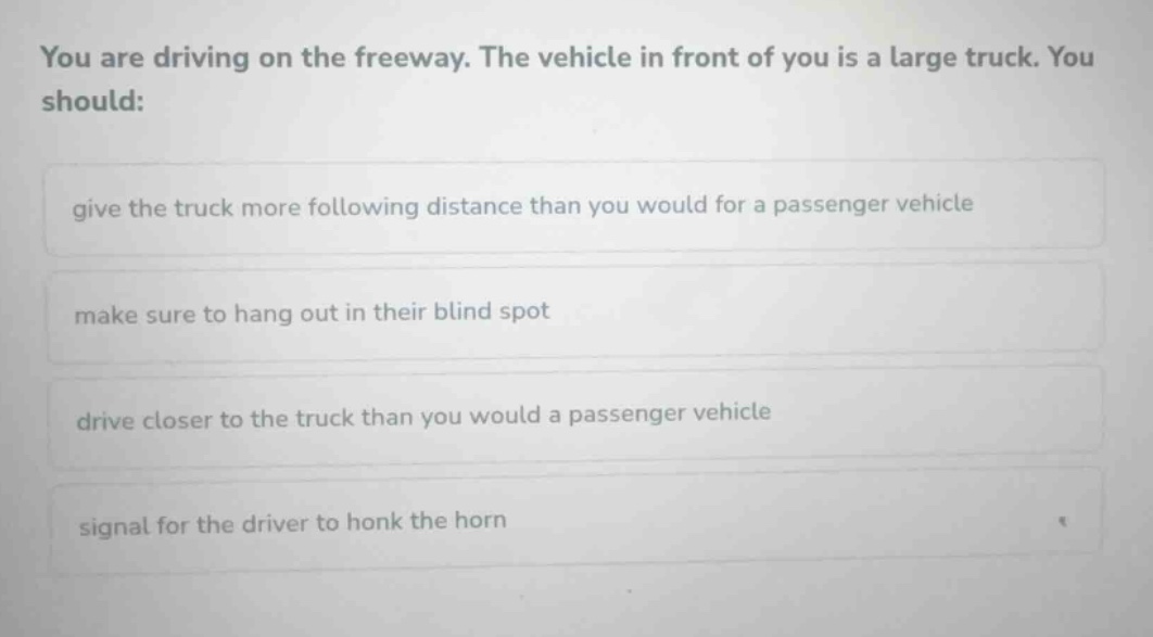 you are driving on the freeway. the vehicle in front of you is a large …