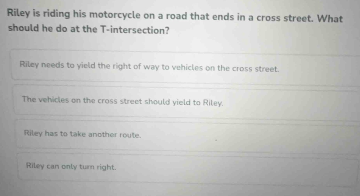riley is riding his motorcycle on a road that ends in a cross street. w…